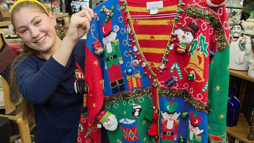 woman holding Christmas sweater