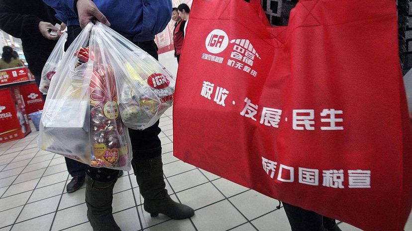 The Chinese government announced a nationwide ban on stores distributing free ultra-thin plastic bags starting June 1, 2008. Chinese people had been using 3 billion plastic bags each day. China Photos/Getty Images