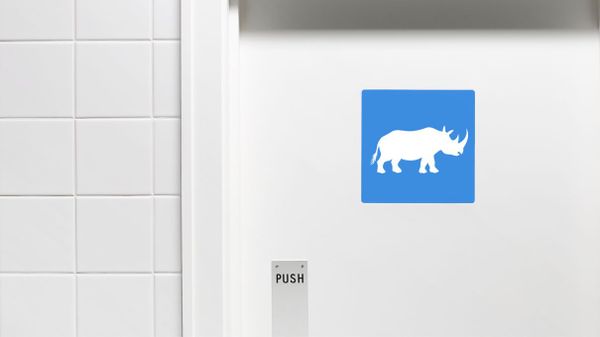 bathroom door with rhinoceros symbol