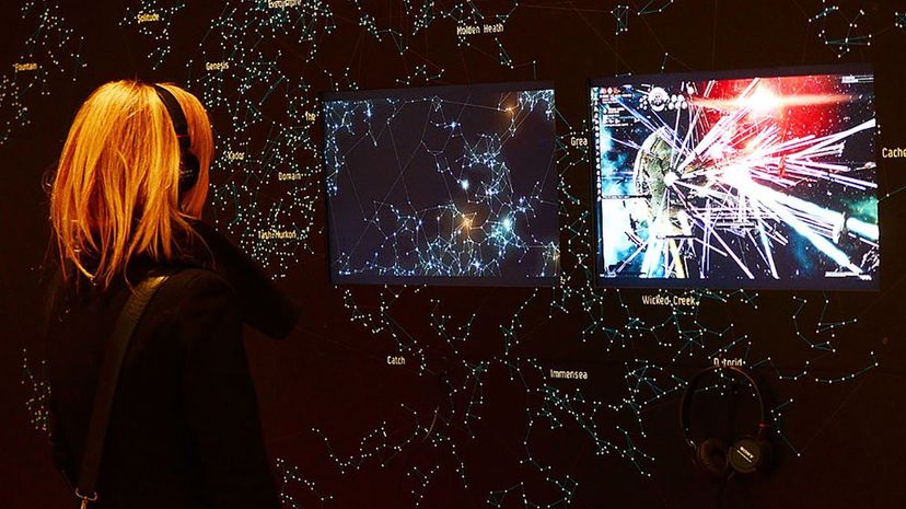 A visitor looks at a display of the video game "EVE Online" at the Museum of Modern Art in New York in 2013. Emmanuel Dunand/AFP/Getty Images