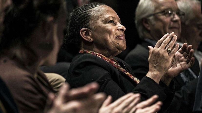 French Justice minister Christiane Taubira applauds during a 2015 campaign rally. Jeff Pachoud/AFP/Getty Images