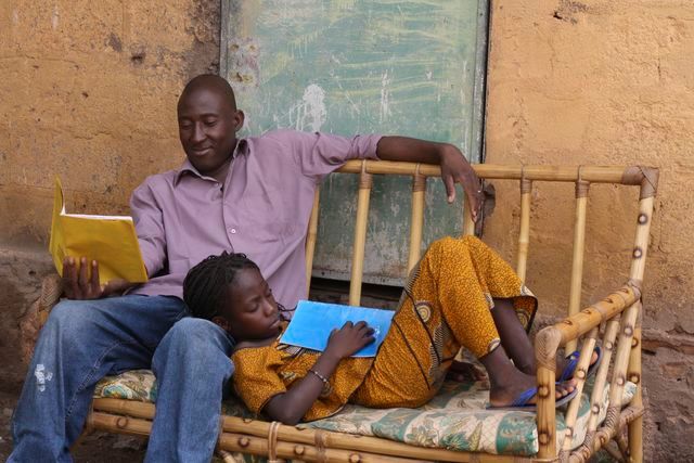 A father and daughter read books