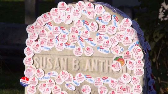 Thousands Line Up to Place Voting Stickers on Susan B. Anthony's Grave