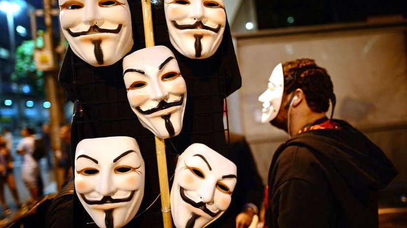 A vendor hawks Guy Fawkes' masks in the streets of Rio in July 2013, as Brazilian workers marched for better work conditions. Fawkes' likeness has been appropriated by all sorts of groups, including Anonymous. ChristopheSimon/AFP/GettyImages