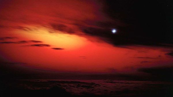 Sun dips below horizon, dusk brings night.