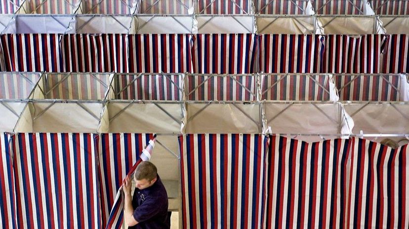 A man leaves a booth after voting at Kennebunk Town Hall  in Portland, Maine. In addition to the state primaries and bond issues, Kennebunk residents voted on school budget expenditures, a non-binding referendum question to prohibit casinos in the town... Gregory Rec/Portland Press Herald via Getty Images