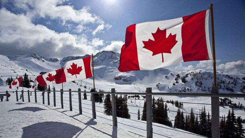 Canadian flags fly at the Roundhouse, Whistler Blackcomb Ski Resort, Whistler, B.C., Canada. Whistler Blackcomb is the largest ski resort in North America. Stuart Dee/Getty Images