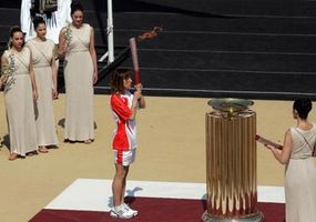 The last Torchbearer, Greece's Olympic silver medalist Chrysopygi Devertzi holds the Olympic torch at the Panathinaikon stadium during the handover ceremony to China on March 30, 2008.