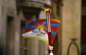 The Tibetan flag flies as the 2008 Beijing Olympics torch is carried by respected sports personalities and celebrities from Wembley Stadium to the grand finale at the O2 Dome, April 6, 2008 in London, England. See more Olympics pictures.