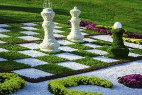 Instead of concrete, this beautifully landscaped outdoor chessboard opts for pebbles, but it doesn't look like those pieces are too mobile.