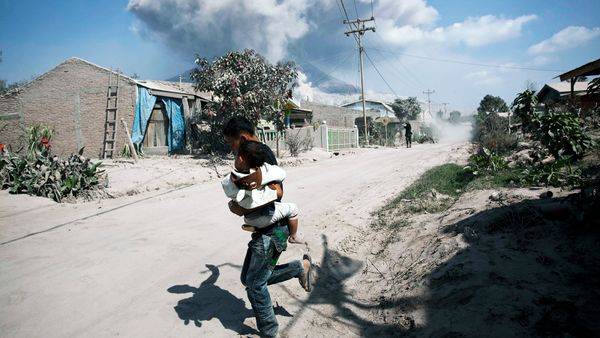 boy outrunning volcano