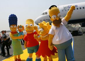 Many U.S. cartoon shows such as The Simpsons, shown here at their big-screen debut, are finished by overseas animators.