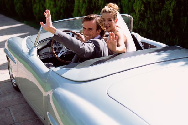 newlyweds in sports car
