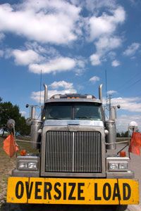 A truck with an oversize load banner