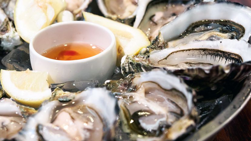 Despite what you may have heard, it's safe to eat raw oysters year-round, as long as you know where they were harvested. Kelvin Kam/EyeEm/Getty Images