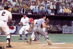 Pete Rose of the Cincinnati Reds bowled over Ray Fosse of the Oakland Athletics to score in the 1970 All-Star Game on July 14 in Cincinnati, Ohio. See more Sports Pictures.