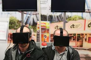 Visitors to the 2013 IFA electronics trade fair in Berlin, Germany in 2013 take the Oculus Rift for a test drive.