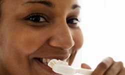 woman brushing teeth