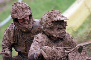 Two muddy guys on bike