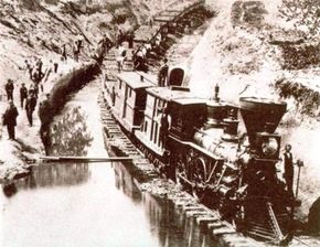 The work of building the first railroads was accomplished with human muscle and dogged endurance. This construction train from the 1850s illustrates the laborious process of moving earth by hand and the fairly crude state of antebellum railroading.