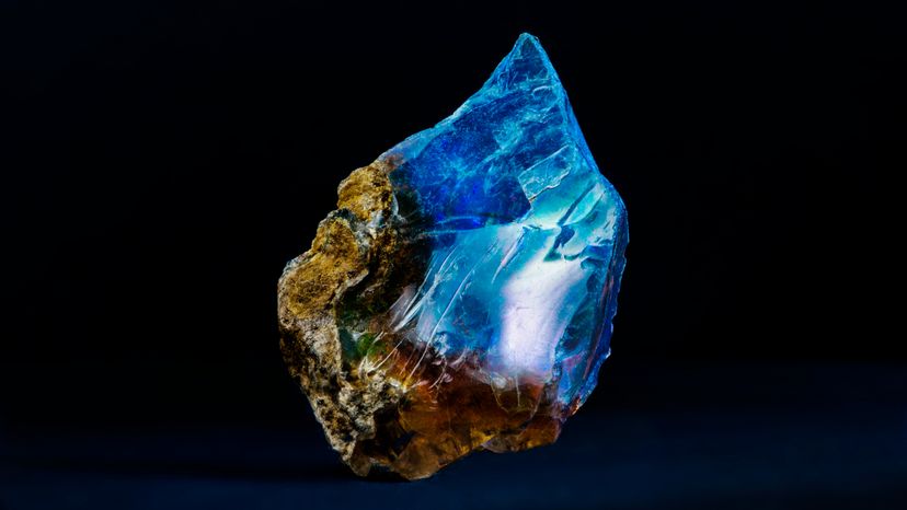 A brown and bluish crystal