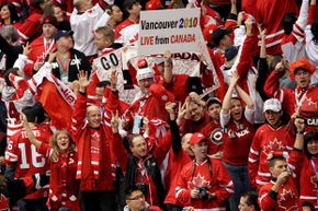 Canada fans cheer on their team during the ice hockey men's gold medal game in Vancouver between the USA and Canada -- which Canada won.