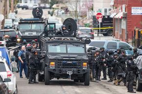 SWAT teams move into position in Massachusetts while searching for a marathon bombing suspect. Phoning in a fake 9-1-1 call about a serious crime can result in a SWAT team descending on an unsuspecting target, a dangerous practice called swatting.
