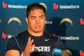 Manti Te'o of the San Diego Chargers speaks with members of the media in 2013. He was victim of a catfish scheme that year.