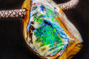 An opal stone on a necklace.