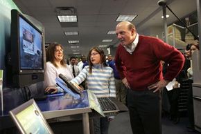 Steve Ballmer, C.E.O. of Microsoft Corporation, watches a customer demonstrate the Windows Vista operating system. See more computer pictures.