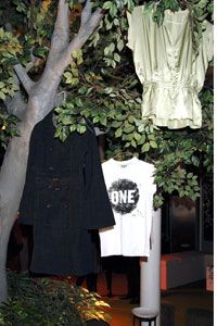 Clothing hangs from a tree at the 2006 launch party of Edun One, a label owned by the rock star Bono and his wife, Ali Hewson, in London.