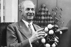 Dr. Linus Pauling holding molecule