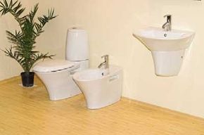 A selection of wall-mounted bathroom fixtures including a toilet, a sink, and a bidet.&nbsp;