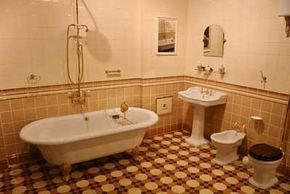 A large claw foot bathtub complimented by small fixtures.&nbsp;