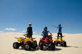 group with atvs in desert