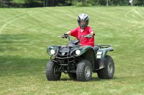 boy on all-terrain vehicle