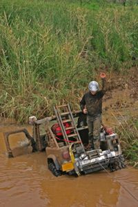 Winch pulling an ATV out of mud