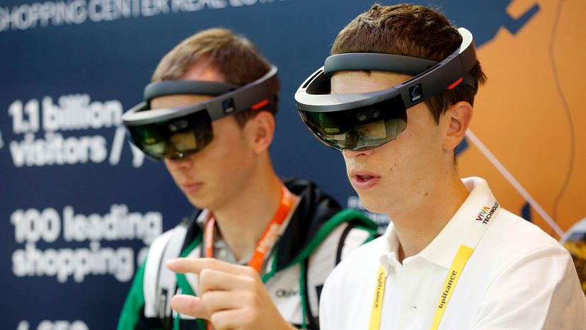 Two males using AR glasses.&nbsp;