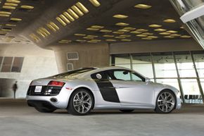 The Audi R8's side blades are swaths of carbon fiber that run directly behind the passenger doors.