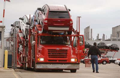 A tractor-trailer leaves a Chrysler assembly plant in Illinois.