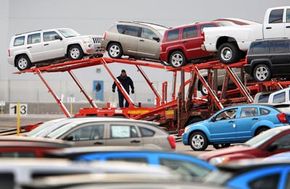 Workers load Chrysler vehicles for transport in Illinois. See more pictures of trucks.
