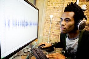 Sound engineer looking at computer