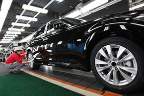 person inspecting car