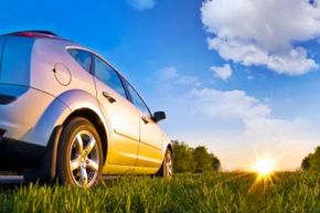 Sunlight shining on car in field