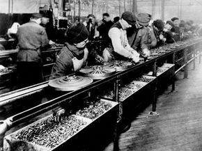 Assembly line employees at work at Ford Motor Company in 1913.