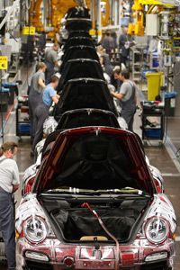 Employees of car manufacturer Porsche assemble the Porsche 911 on a production line in Stuttgart, Germany, in 2008.