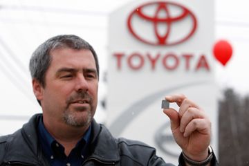 Dan Daigle, service manager at Lee Toyota in Topsham, Maine, holds a shim that will be used to repair springs in the gas pedal systems of recalled Toyota automobiles.