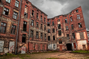 This abandoned building was the view I had from my room. - Picture