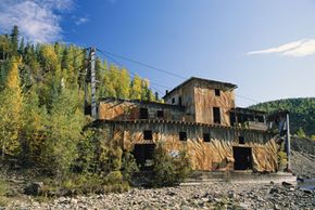 Some abandoned mines, like this former gold mine, built in 1934 in Alaska, are left with buildings intact. See more Alaska pictures.