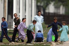 Mormons children and their mother playing outside